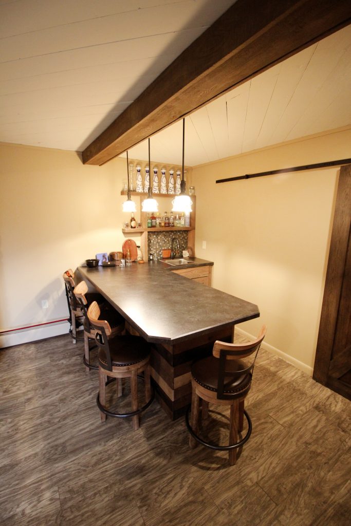 Renovated basement with wet bar