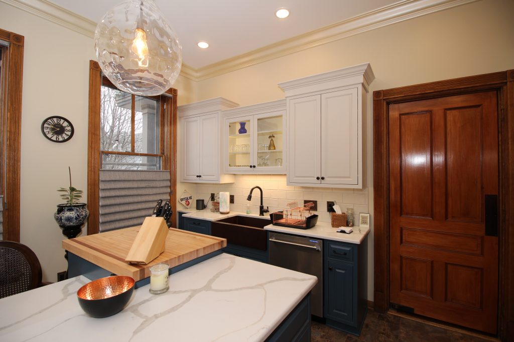 Remodeled kitchen with island and cutting board
